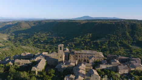 aerial pullback reveals old italian village built on a cliff in lazio