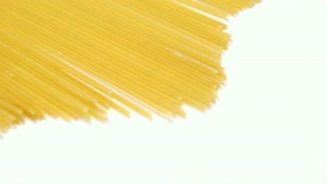 Raw-spaghetti-arranged-on-white-background