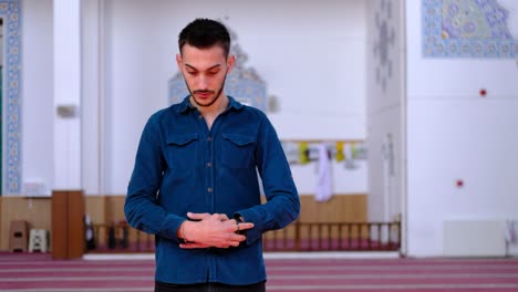 Young-Man-Stands-and-Worships-in-A-Mosque-3