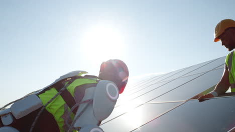 robotic exoskeleton assisting solar panel maintenance