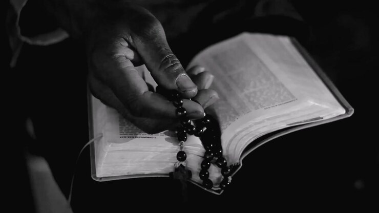 praying to God with hand on bible with people stock video stock footage