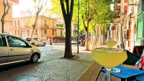 street view with drink and passing vehicles