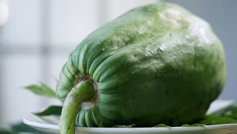 Close-up-to-a-ripe-yellow-papaya-with-spots-on-it-vegan-vegetarian-fruit-paw-paw-vegan-vegetarian