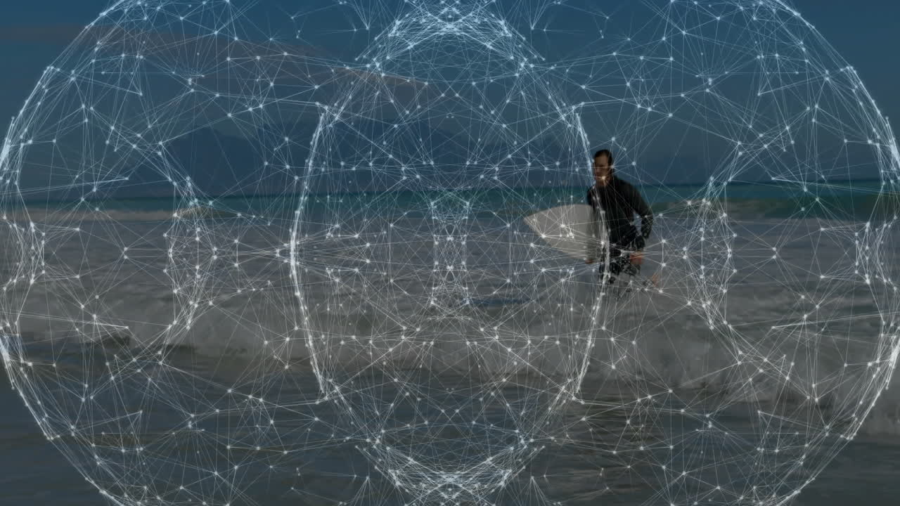 male surfer carrying surfboard emerging from ocean surf, displaying technology network overlay