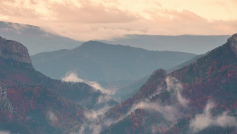 Close-up-detail-shot-of-Roncal-valley-in-Spain-pyrenees-during-misty-low-clouds-and-high-clouds-cloudy-sunrise-beautiful-valley-during-fall-autumn-season-timelapse