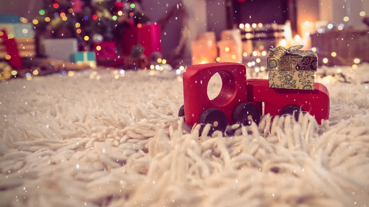 Red toy car on a carpet in a living room decorated for christmas combined with falling snow