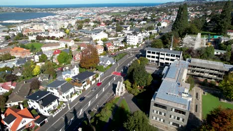 Drone-flyover-Otago-Boys-High-School-historic-architecture-building-in-Dunedin,-New-Zealand