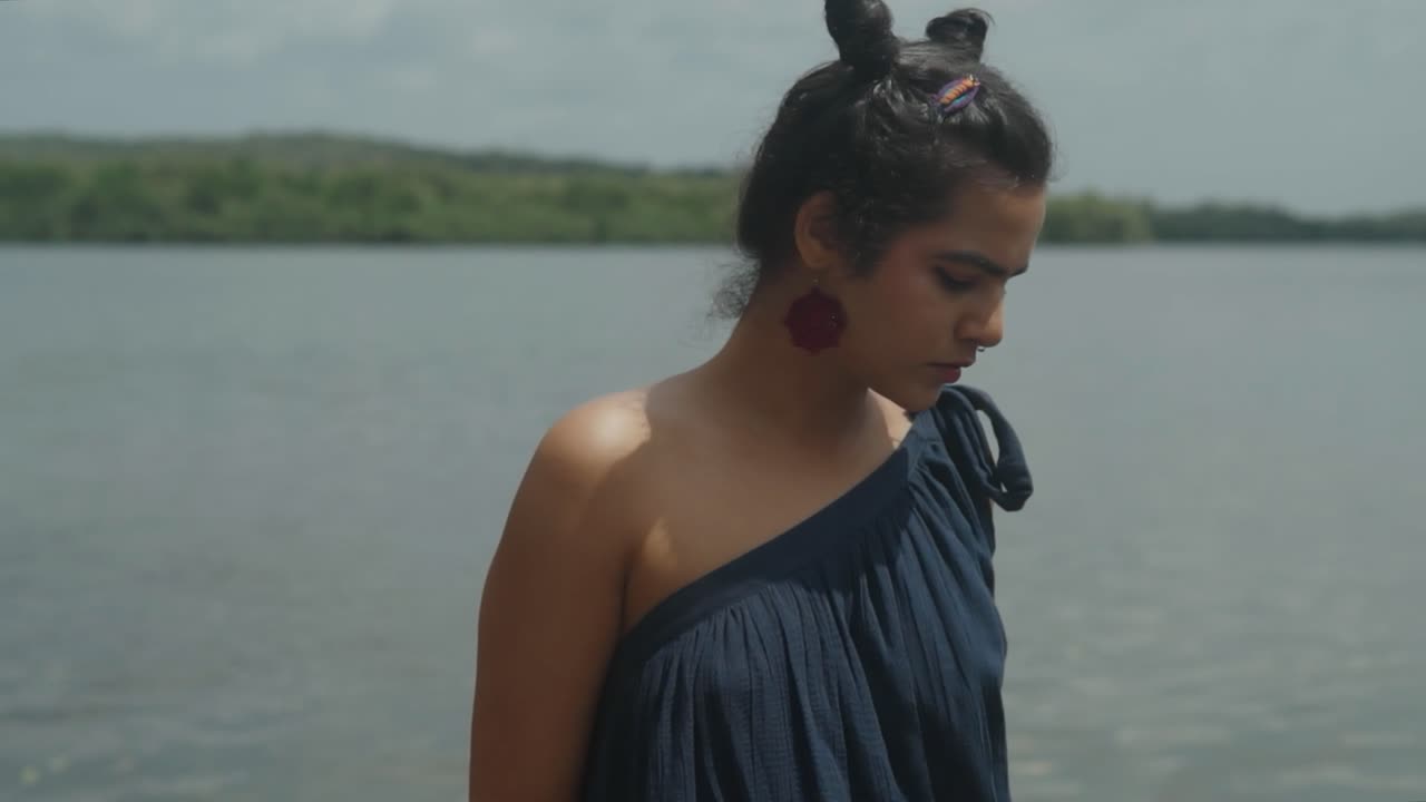 Beautiful young Asian model in a close-up with a lovely setting in the background and donning distinctive clothing with a wonderful current hair&nbsp;style