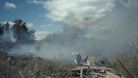 firefighters in action on a farm in flames in chile