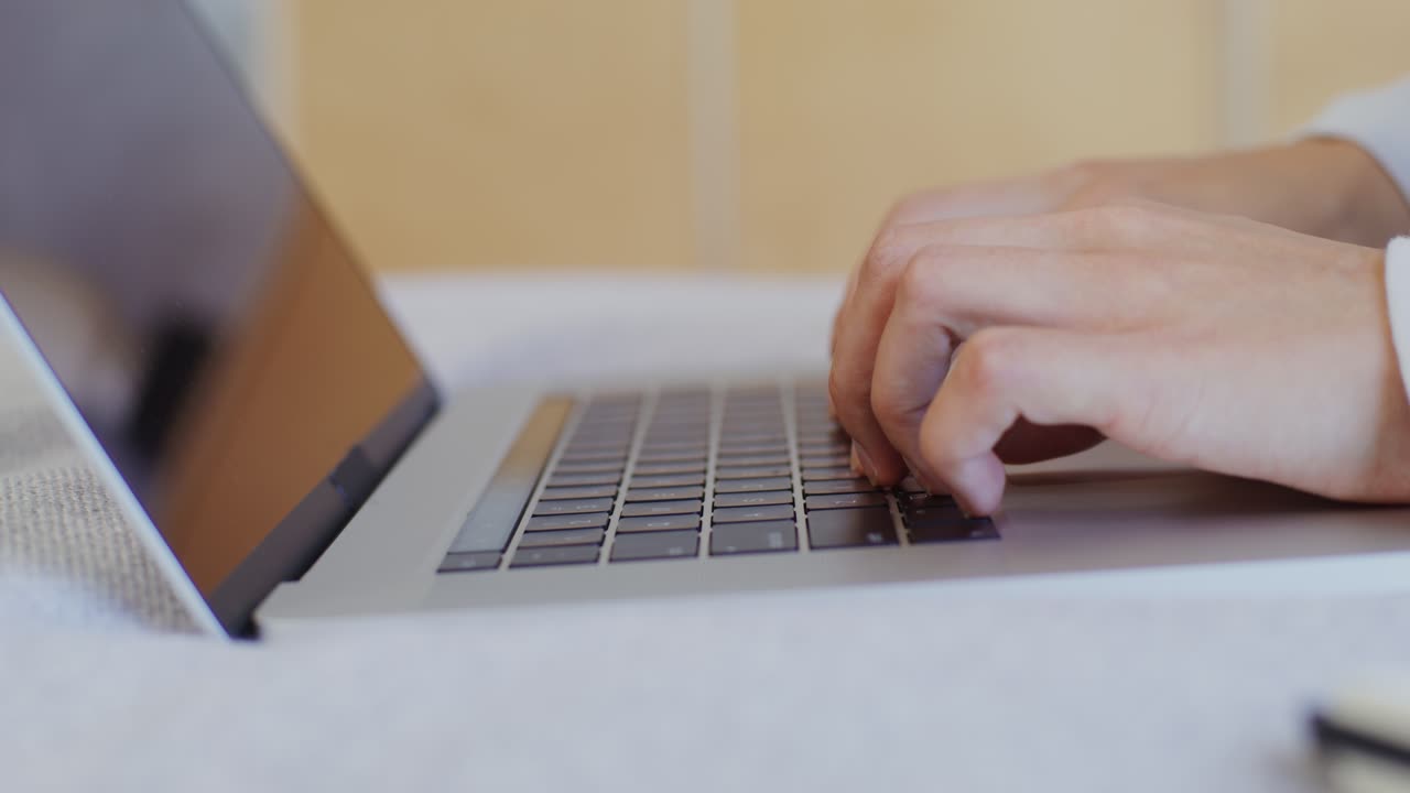 Person Typing on a Laptop