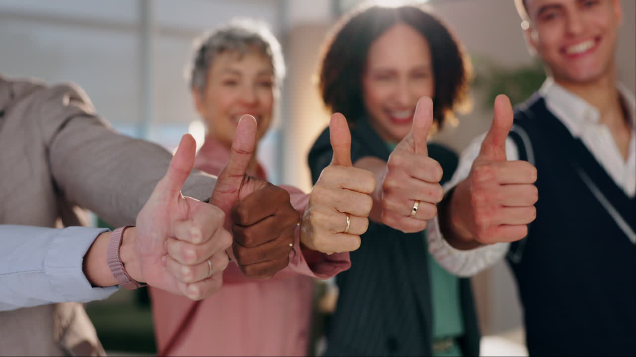 Diverse business team giving thumbs up