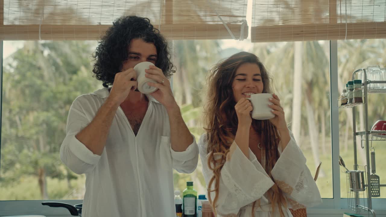 Couple Kissing and Enjoying Coffee in a Cozy Kitchen