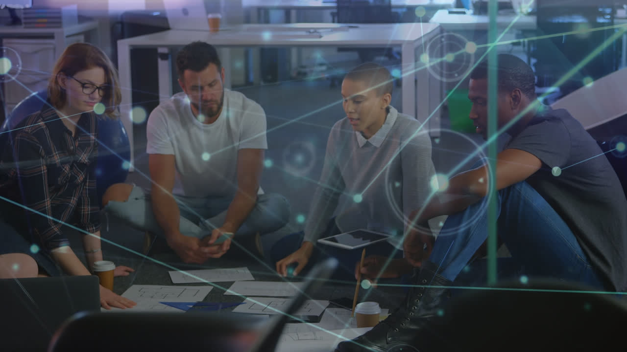 Animation of network of connections over diverse businesspeople working in office