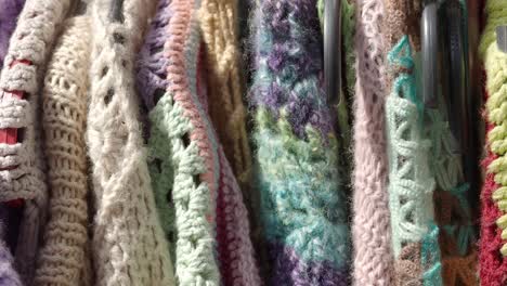 colorful knitted and crocheted textiles on display