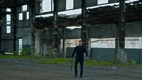 bodybuilder with baseball bat. brutal man bodybuilder with baseball bat