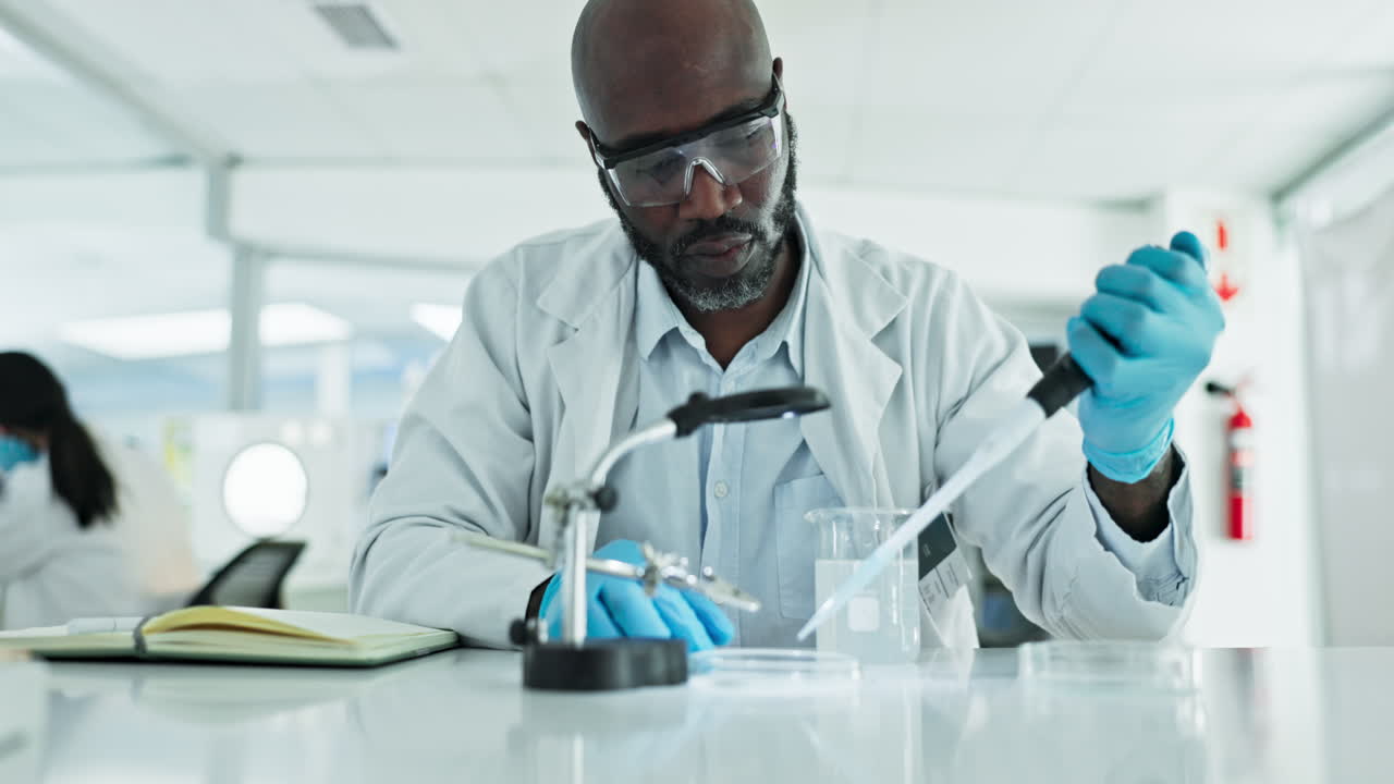 Black man, dropper or scientist in laboratory