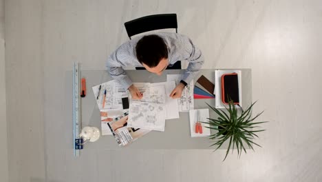 top view of smiling office worker looking at the camera