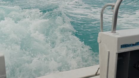 water trail behind fast moving motor boat