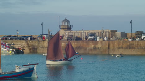 traditional cornish sailboat in the sea in st