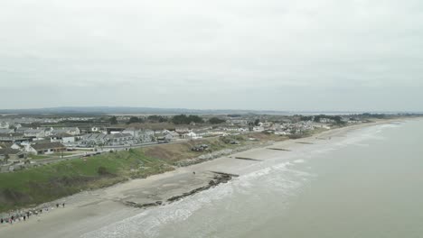 Panoramic-View-Of-Rosslare-Town-And-Beach-In-County-Wexford,-Ireland---drone-shot