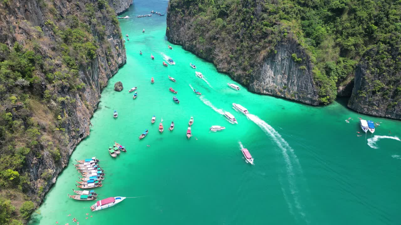 Tourism and tour boats at crowded Pileh Lagoon on Phi phi island, Aerial
