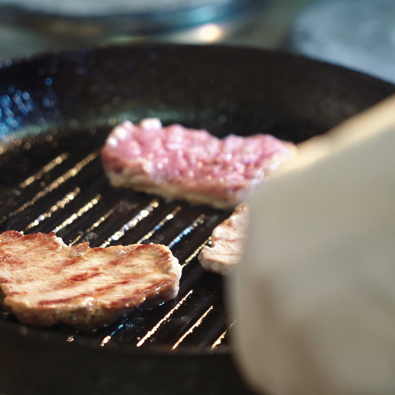 Seasoned sirloin steak in griddle pan. Sqare video