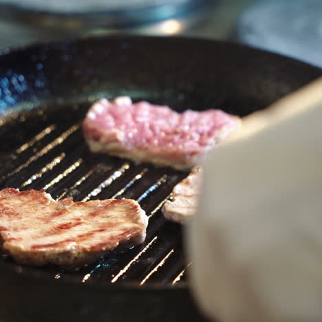 seasoned sirloin steak in griddle pan. sqare video