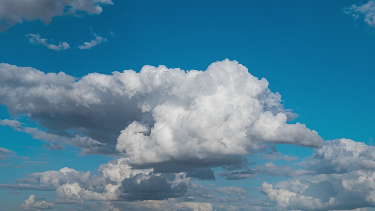 Clouds time lapse light blue moving skyline cumulus low level fluffy
