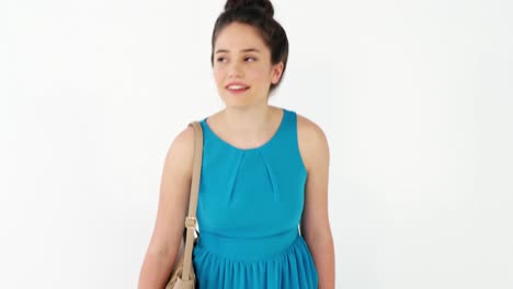 Woman-holding-shopping-bag-against-white-background