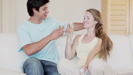 a couple toasting glasses of champagne