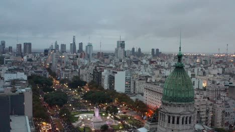 Aerial-at-dusk-around-the-dome-of-the-Palace-of-the-Argentine-National-Congress-at-Plaza-Congreso,-Buenos-Aires,-Argentina