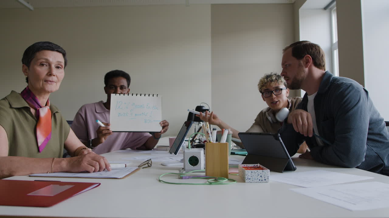 Business Team Discussing Growth Strategy in Office Meeting