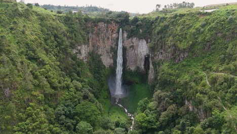 exploring sipiso piso waterfall from above in sumatra, indonesia