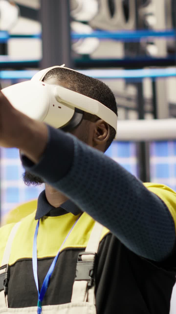 Vertical video Engineer in smart factory does maintenance using VR headset tech