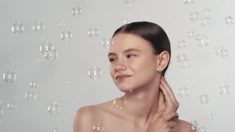smiling attractive young adult woman model looking at camera happy beautiful 30s brunette lady prof smiling attractive young adult woman model looking at camera happy beautiful 30s brunette lady professional pretty face dental smile posing stand alone indoors slow motion close up view portrait