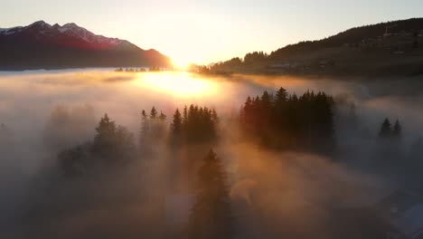 dense clouds over mountain valley at sunset