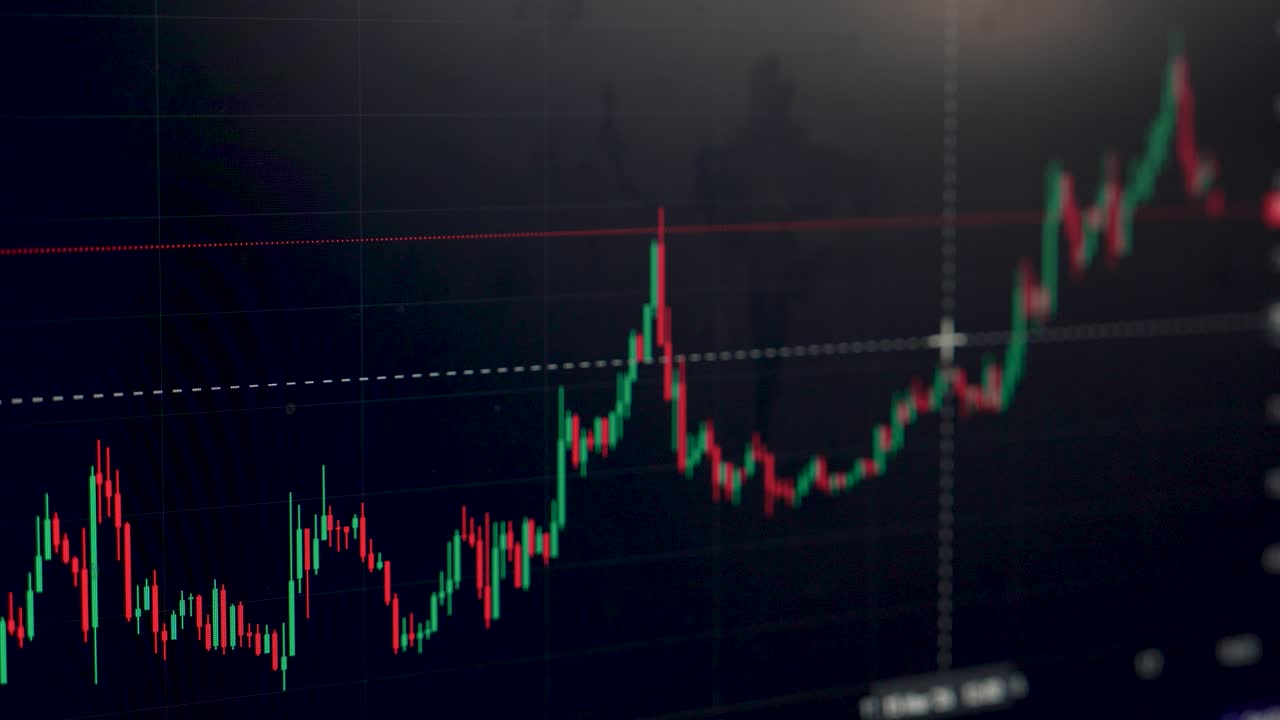 I grafici mostrano i prezzi delle azioni in movimento, evidenziando le tendenze nell'attività di trading. I trader analizzano i punti dati per prendere decisioni basate sui cambiamenti del mercato.