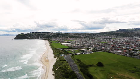 dunedin city on pacific ocean coastline from above