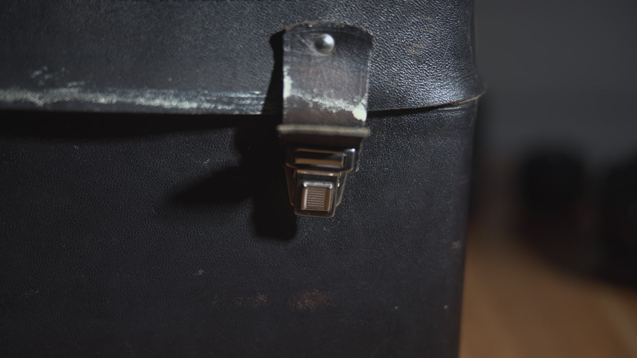 Detailed Metal Clasp On Worn Leather Surface, Closeup Macro View, Aged Fastener With Patina, Shallow Depth . Media