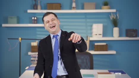 Fun-and-positive-businessman-looking-at-camera-and-dancing.