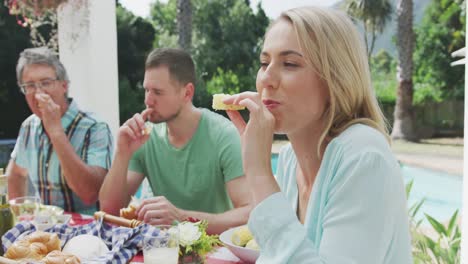 happy family eating together at table