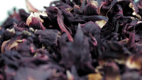 hibiscus tea, karkade. close-up. rotation food. tea of large, dry, red hibiscus flowers. herbal tea background