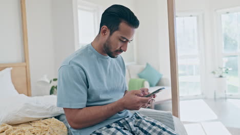 Typing-chat,-man-and-a-phone-in-the-bedroom