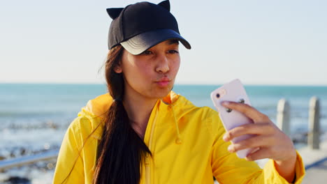 selfie, beach and woman with smartphone