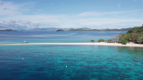 Aerial-view-of-the-ocean-over-Banana-Island-during-sunset