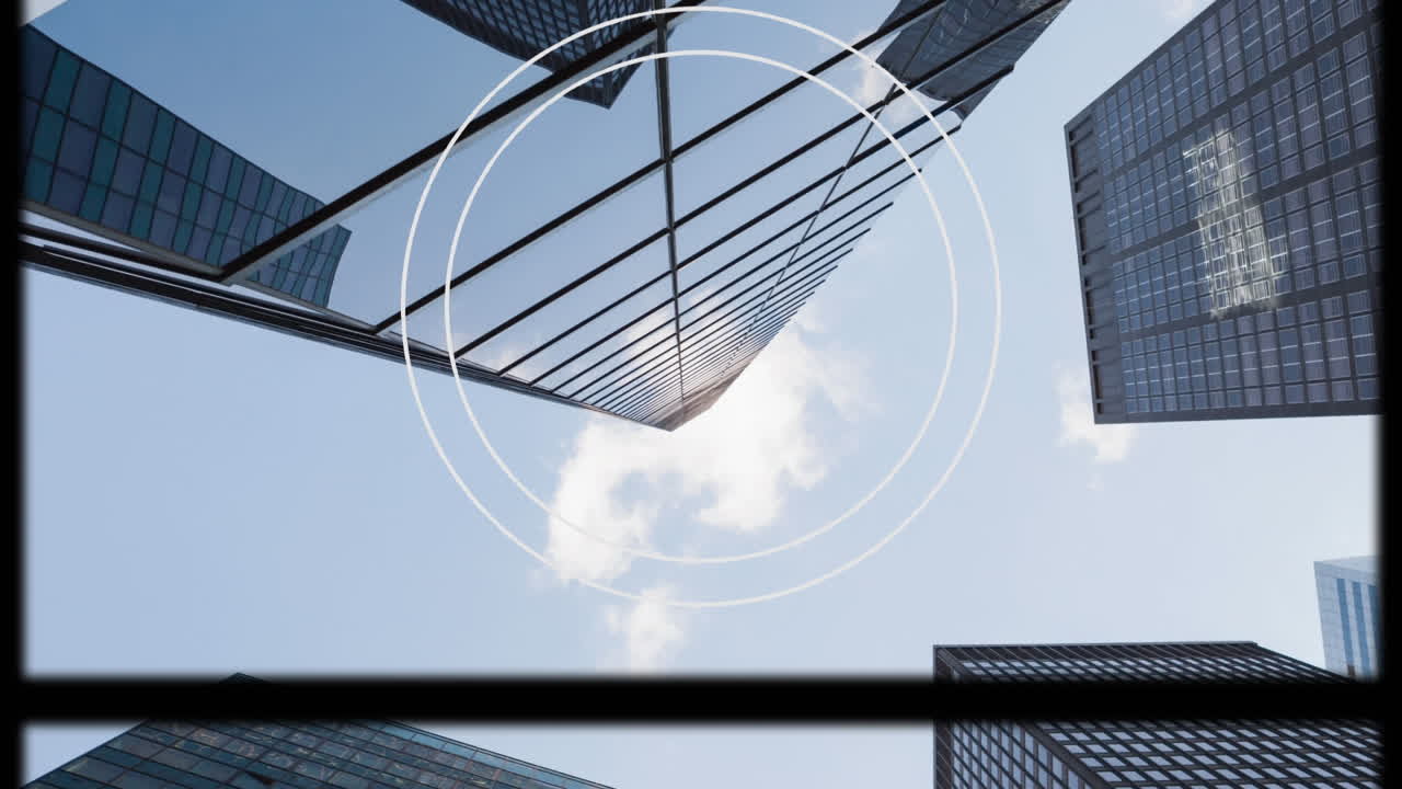 Animation of circular scope and slipping frame over modern city buildings and blue sky