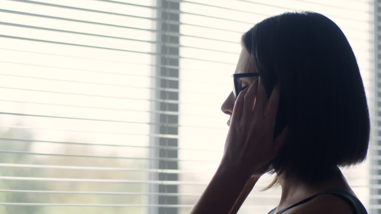 Close Up View Of A Businesswoman Gently Touching Her Face Near The Window In The Office