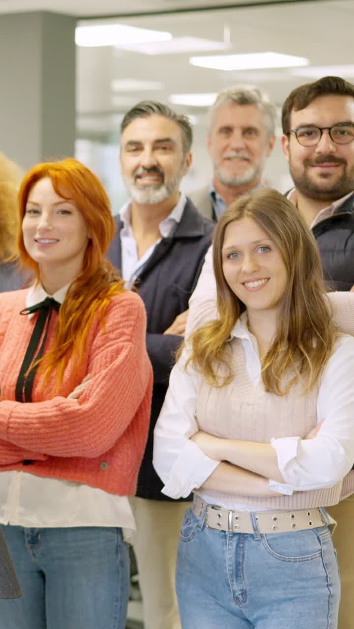 Group of colleagues smiling at camera in a coworking space