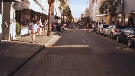 driving plate front, car driving through king street, downtown charleston