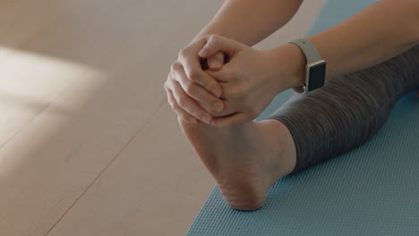 beautiful young caucasian woman practicing yoga seated forward bend pose workout instructor showing posture guiding fitness class in studio